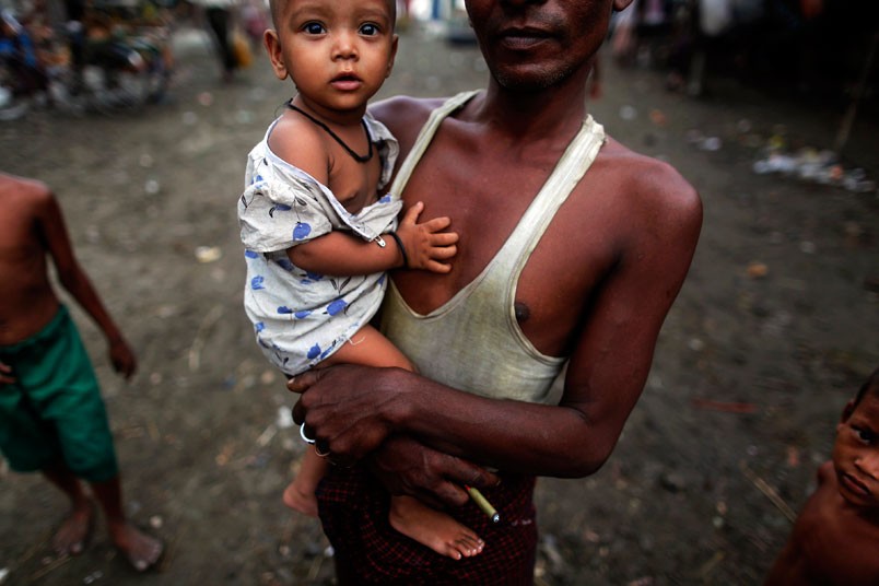Picture link: The Telegraphবাচ্চা বুকে নিয়ে এক রেহিঙ্গা পিতা,  Picture: REUTERS/Damir Sagol